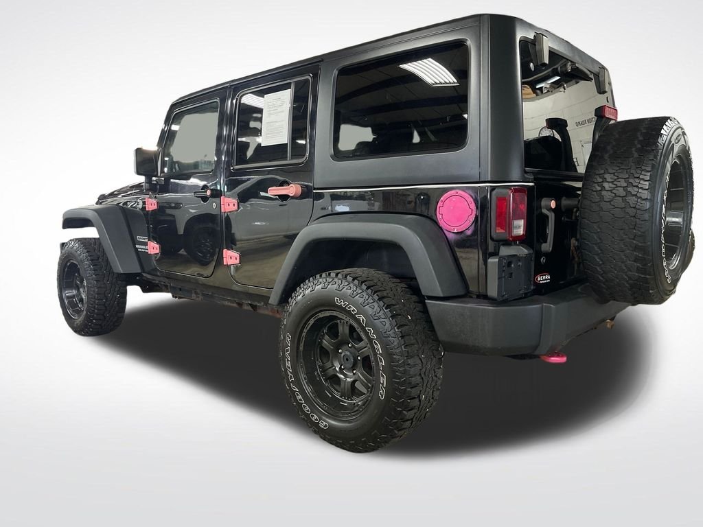 Used 2013 Black Jeep Unlimited Sport image 3