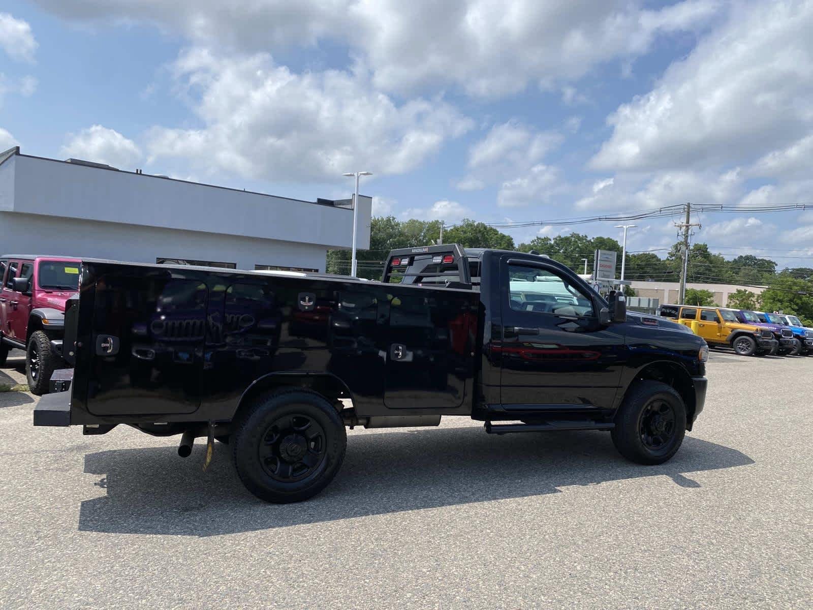 Used 2024 Diamond Black Crystal Pearlcoat Ram Tradesman image 2
