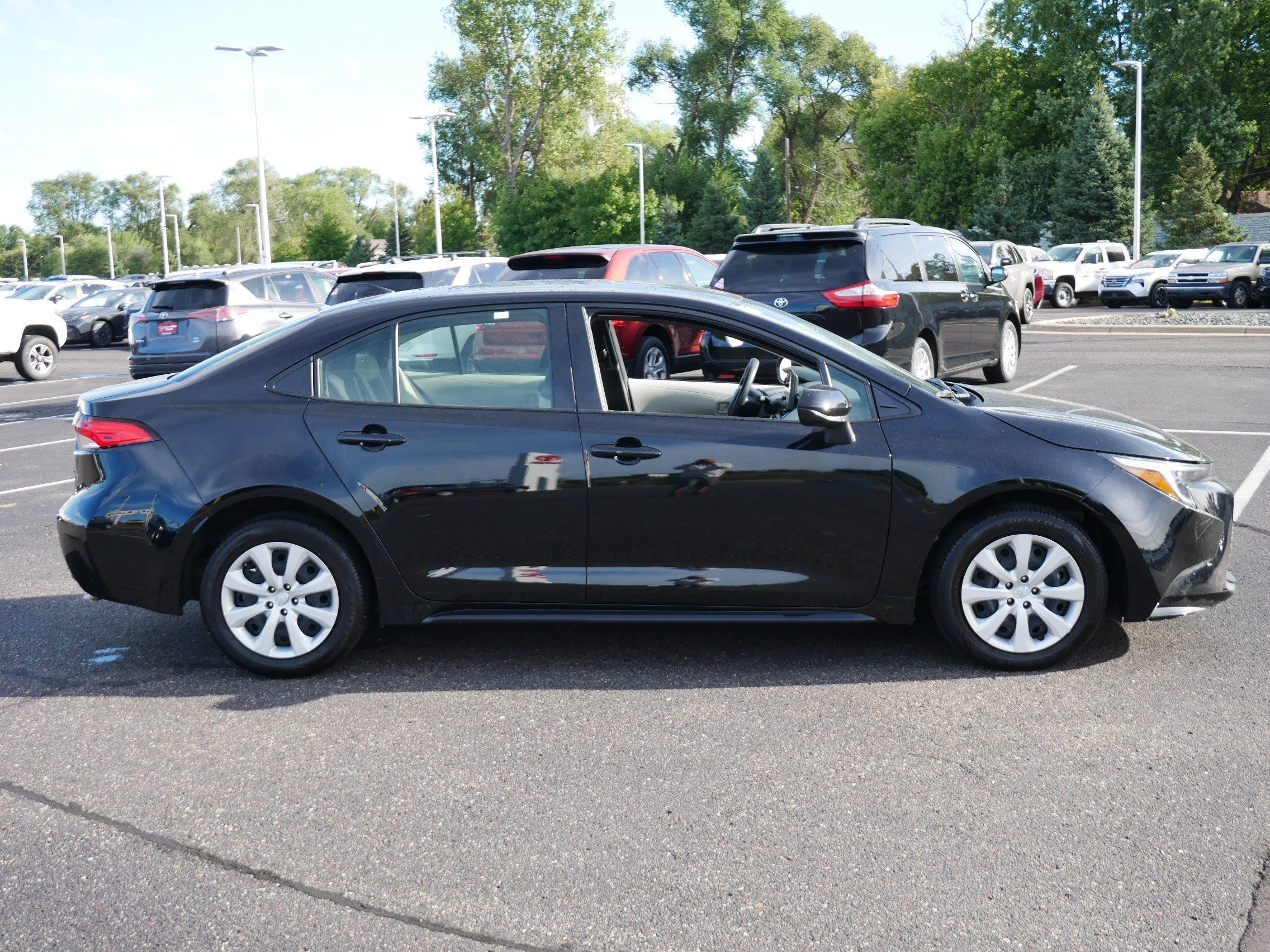 Used 2025 Midnight Black Metallic Toyota Hybrid LE image 8