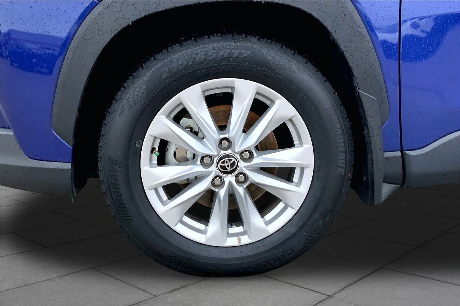 Used 2024 Blue Crush Metallic Toyota LE image 11