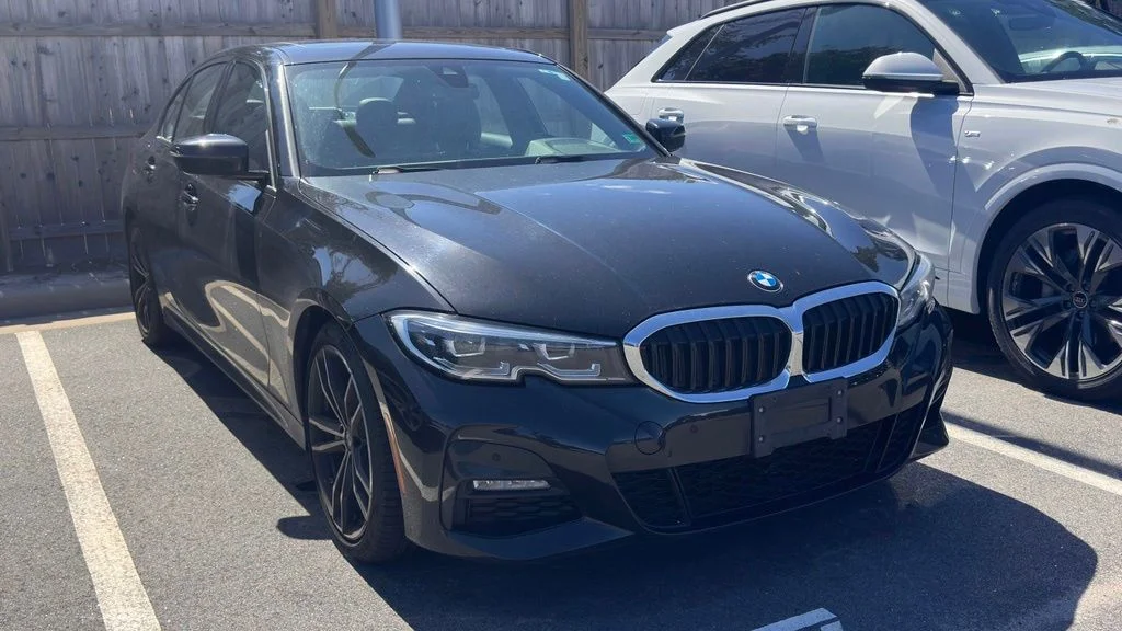 Used 2022 Black Sapphire Metallic BMW 330i image 1