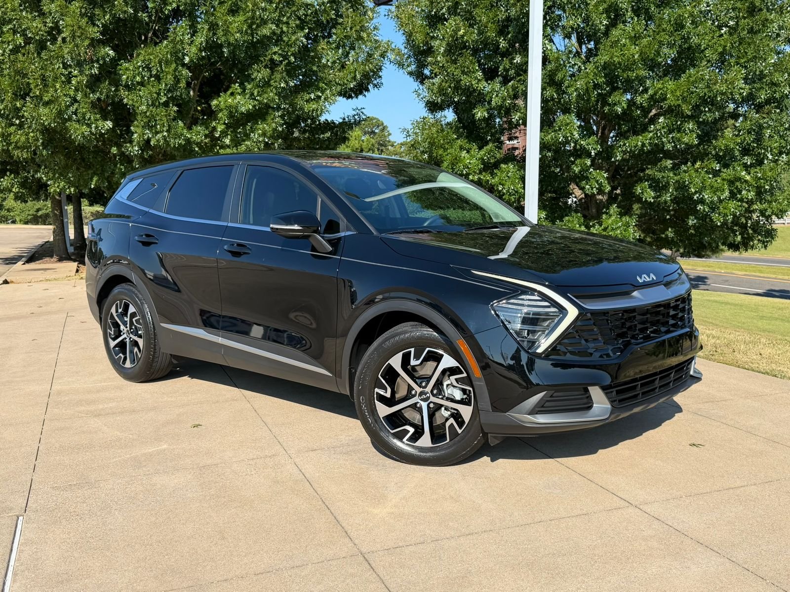 Used 2024 Ebony Black Kia EX image 1