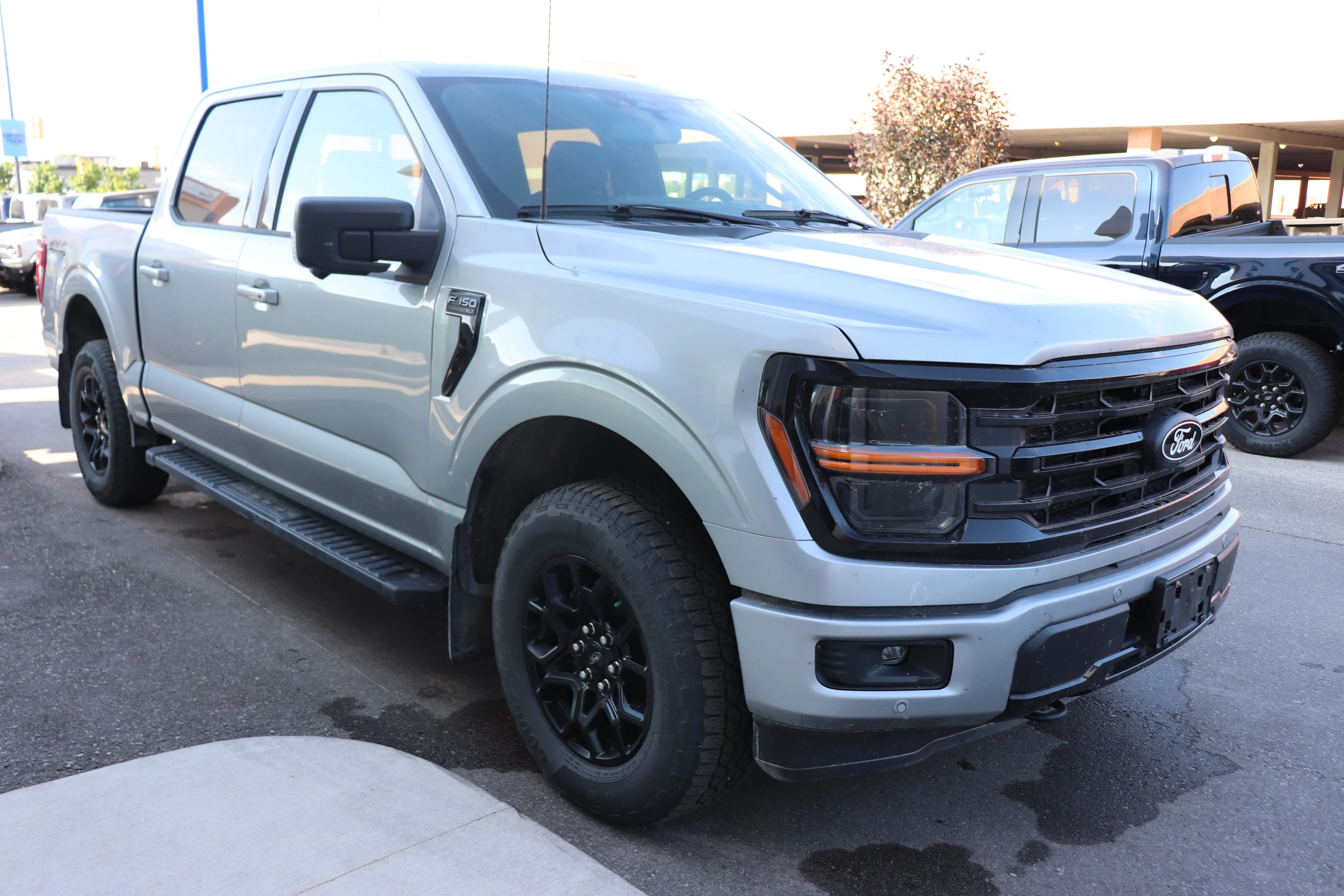 Used 2024 Silver Ford XLT 4WD SuperCrew 5.5
