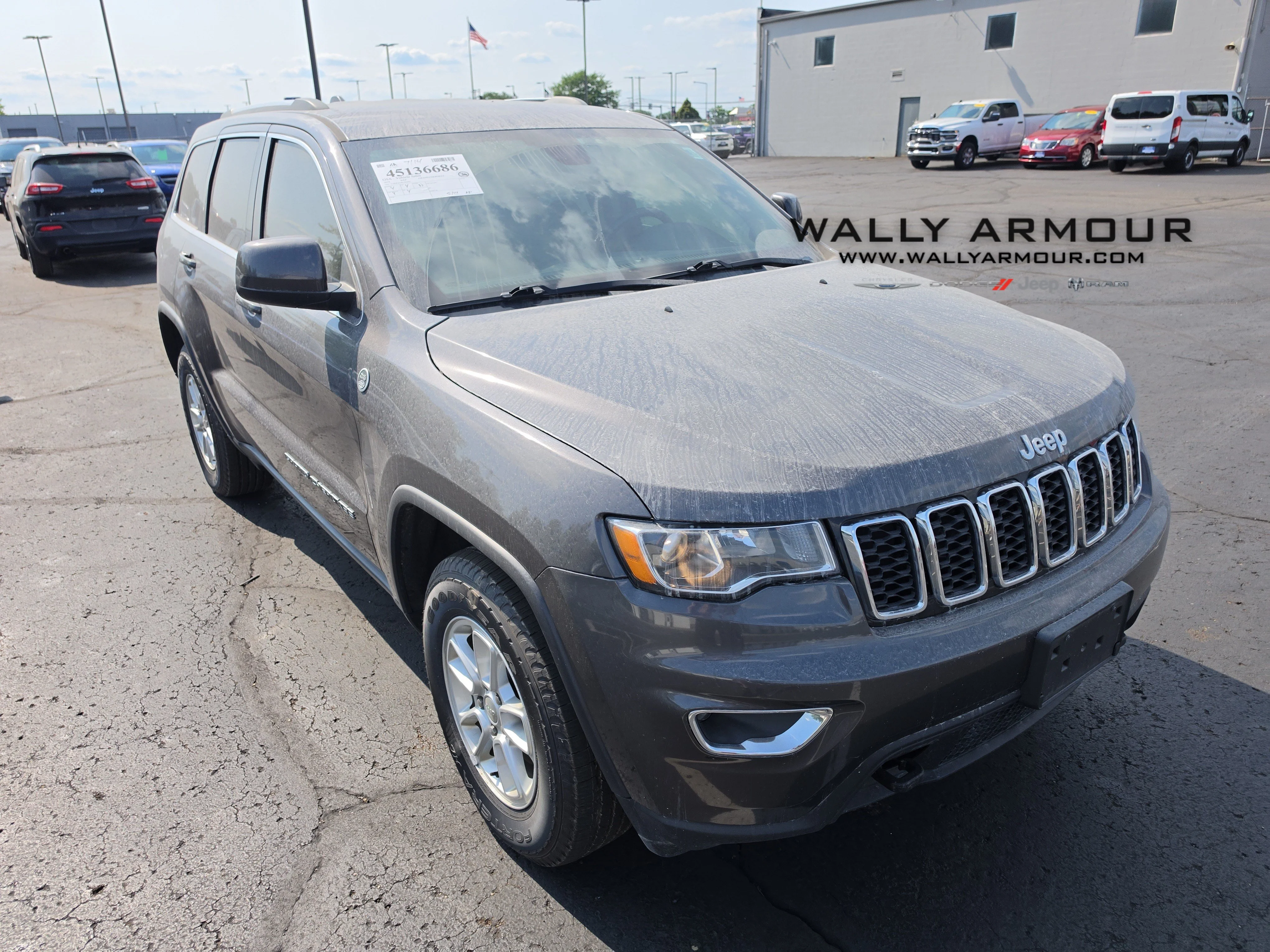 Used 2019 Granite Crystal Metallic Clearcoat Jeep Laredo E image 1