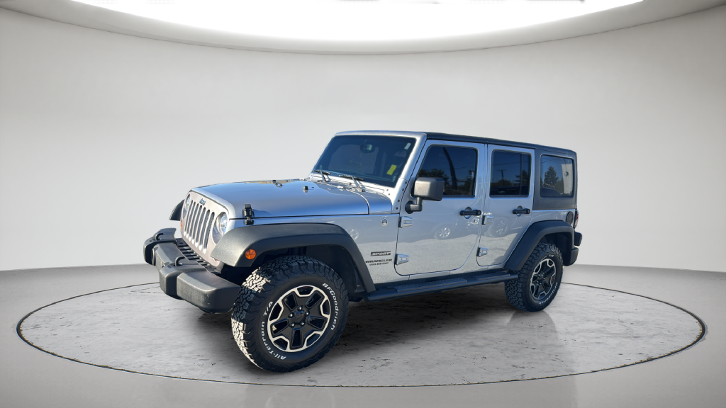 Used 2013 Silver Jeep Unlimited Sport image 1