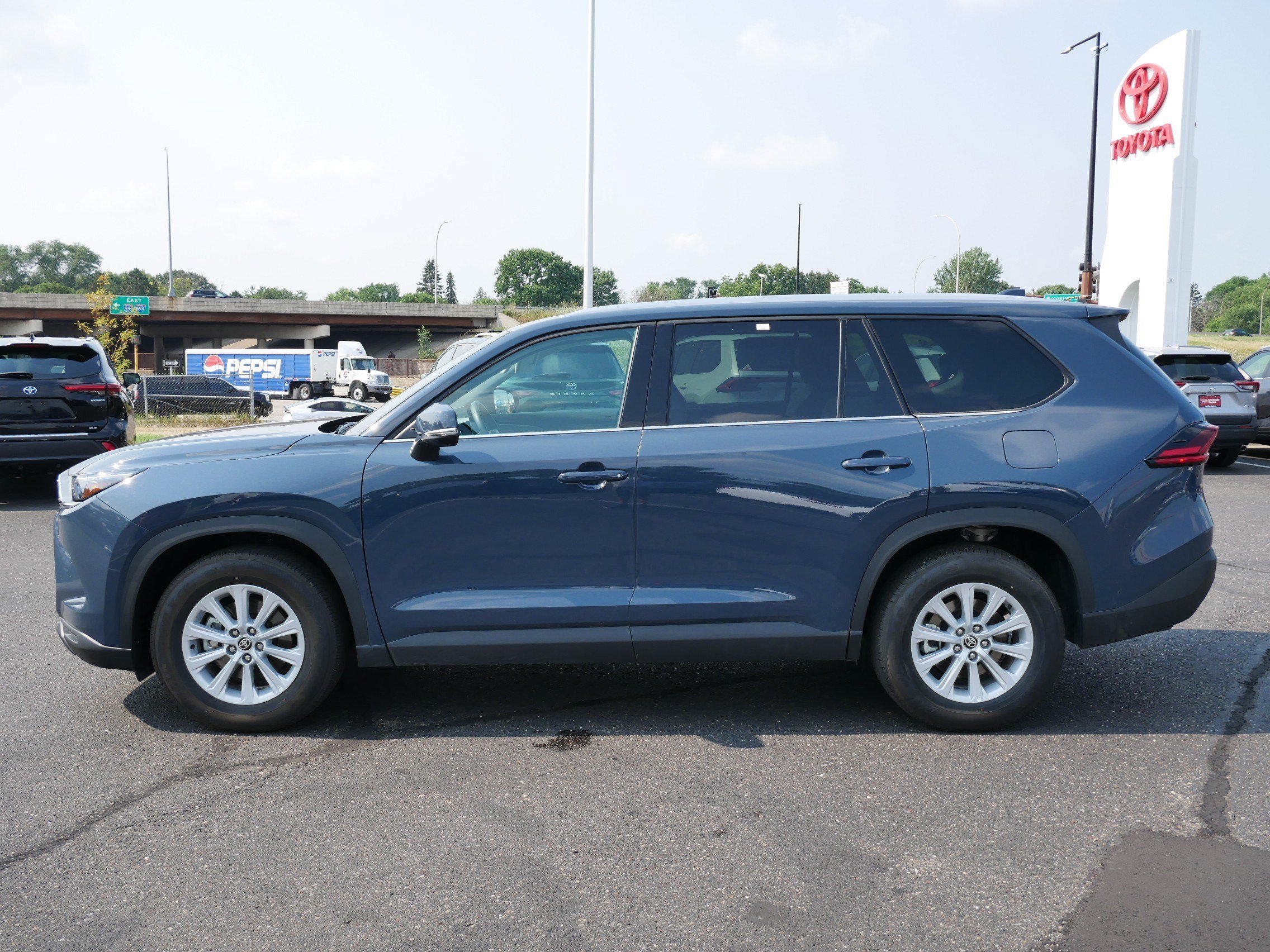 Certified 2026 Toyota Grand Highlander XLE with VIN 5TDAAAB55TS121706 for sale in Brooklyn Center, Minnesota