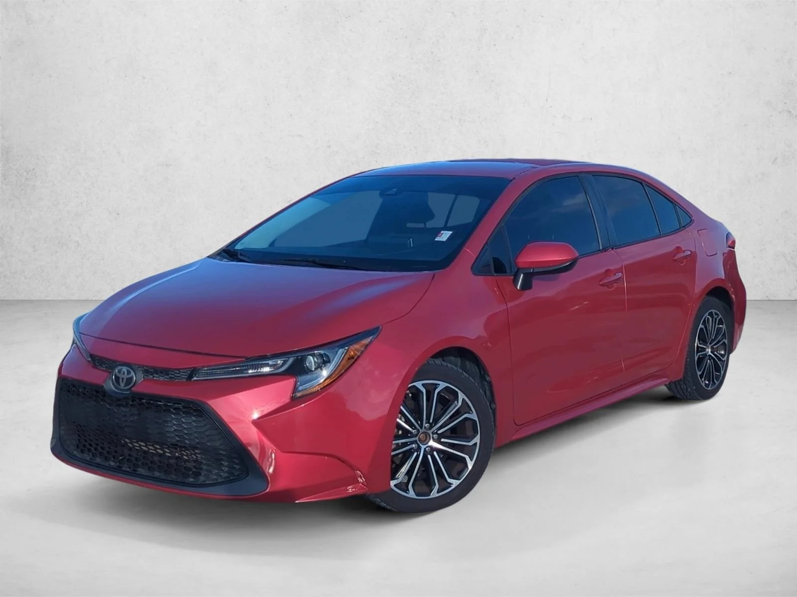 Used 2020 Barcelona Red Metallic Toyota LE image 1