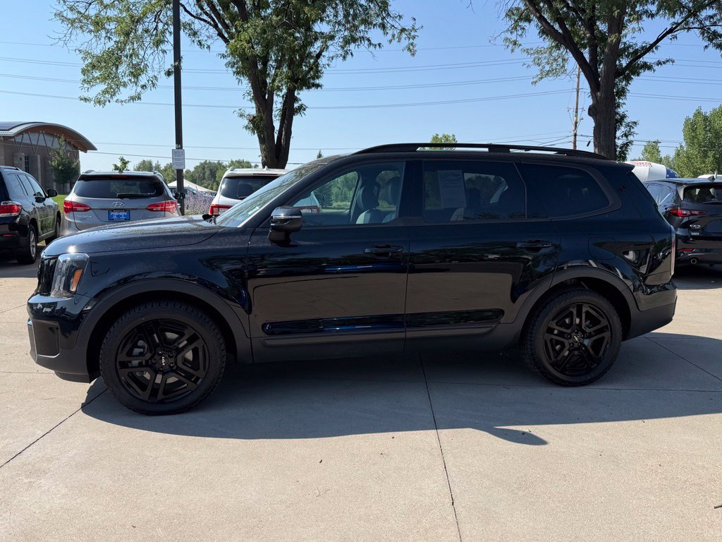 Used 2024 Ebony Black Kia EX X-Line image 7