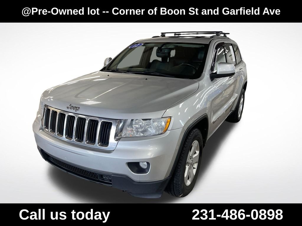 Used 2012 Silver Jeep Laredo image 1