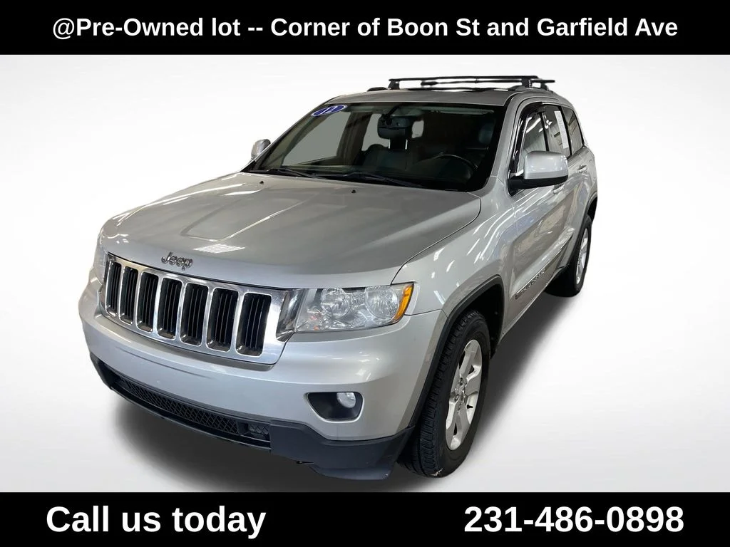 Used 2012 Silver Jeep Laredo image 1