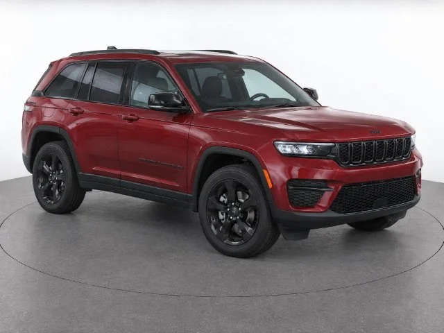 Used 2025 Velvet Red Pearlcoat Jeep Laredo image 1