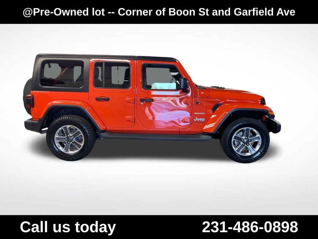 Used 2018 Orange Jeep Unlimited Sahara image 6