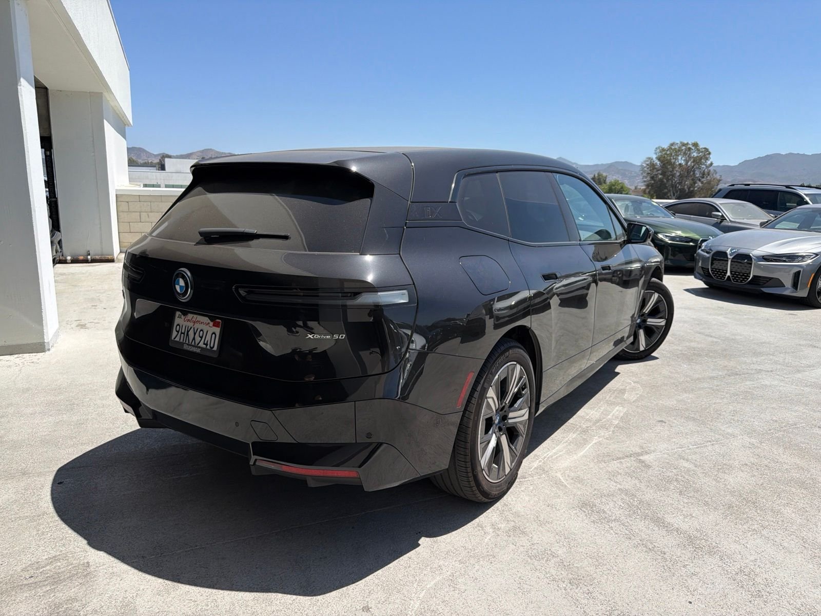 Used 2024 Black Sapphire Metallic BMW xDrive50 image 4
