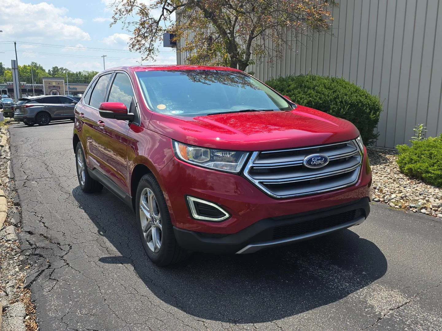 Used 2017 Ruby Red Metallic Tinted Clearcoat Ford Titanium image 1