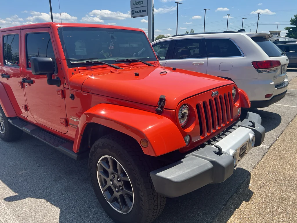Used 2015 Sunset Orange Pearlcoat Jeep Sahara image 9