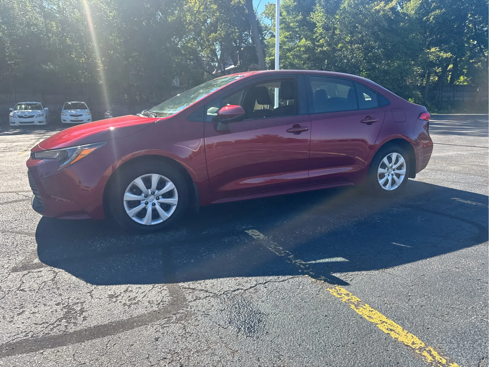 Used 2024 Ruby Flare Pearl Toyota LE image 3