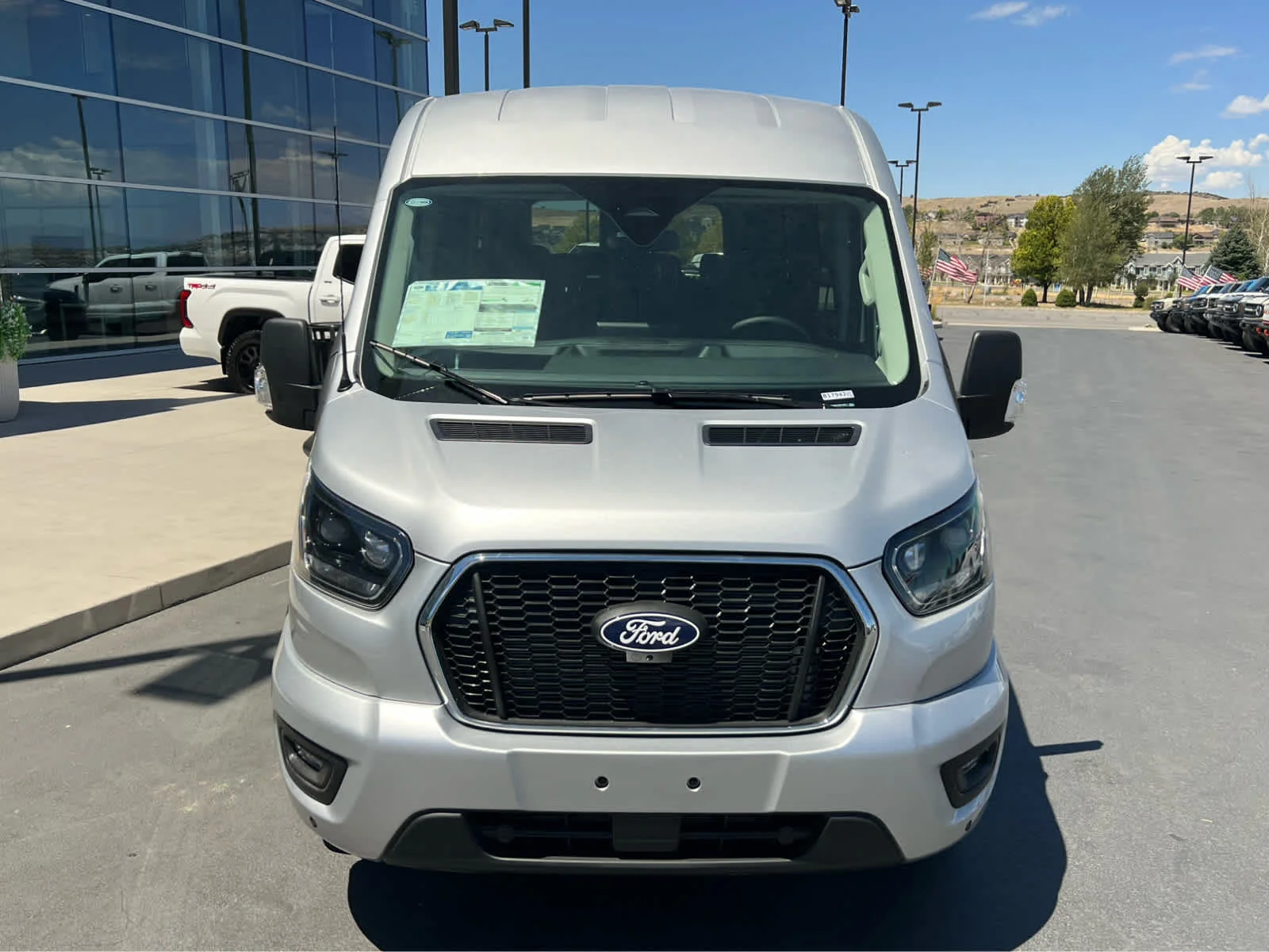 New 2026 Ingot Silver Metallic Ford Passenger Van XLT image 3