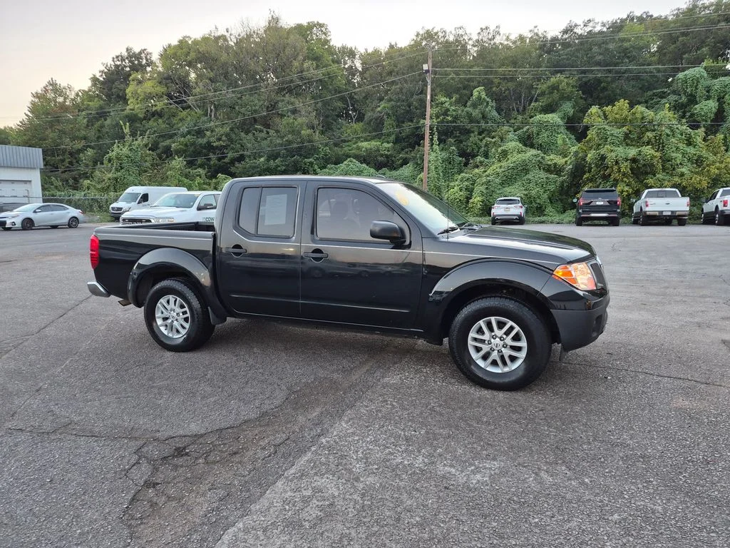 Used 2016 Magnetic Black Nissan SV image 1