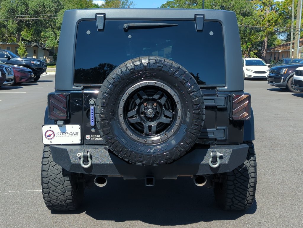 Used 2015 Black Jeep Unlimited Sahara image 6