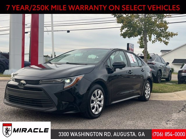 Used 2025 Midnight Black Metallic Toyota LE image 1