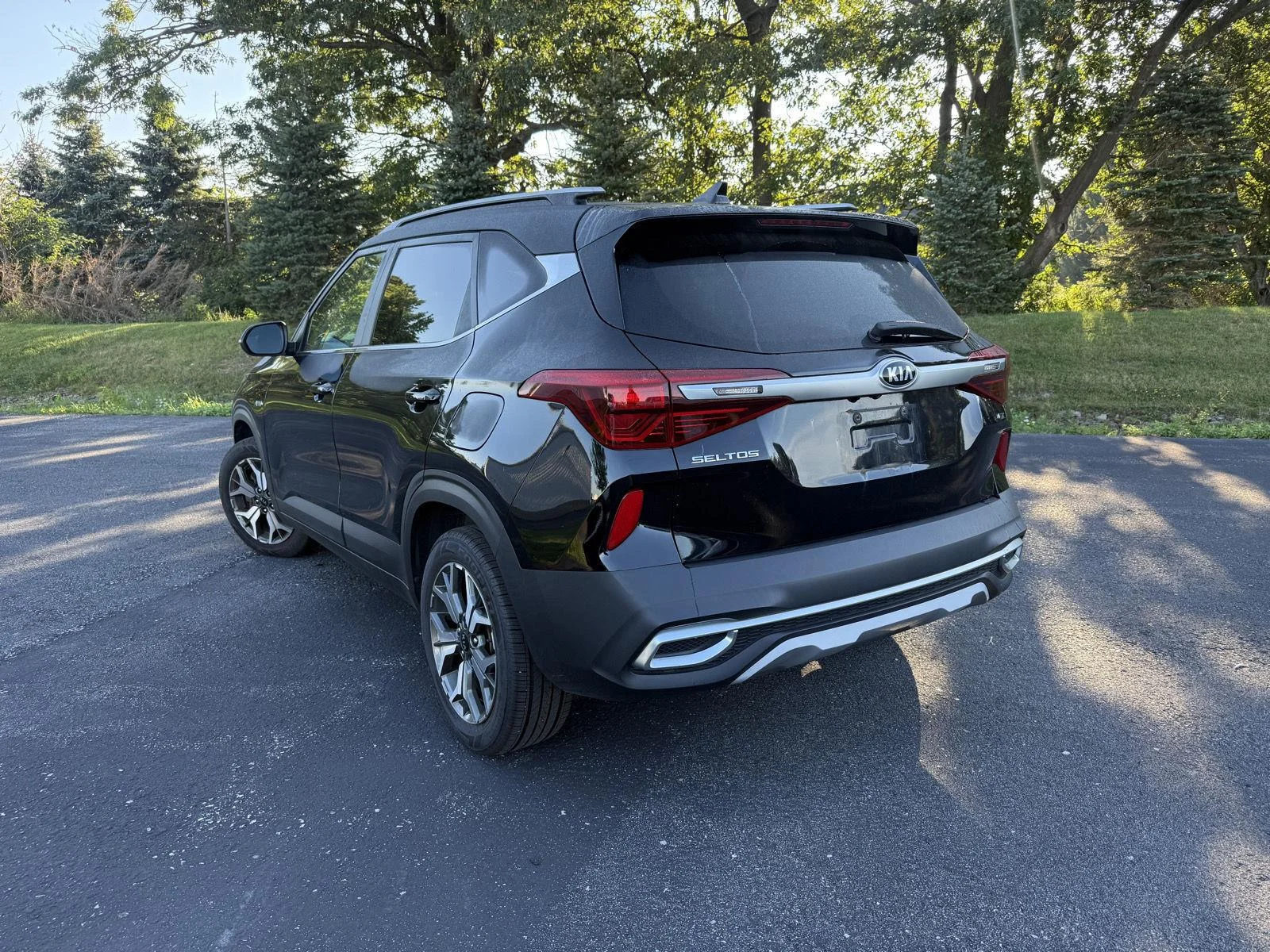 Used 2021 Cherry Black Kia EX image 2