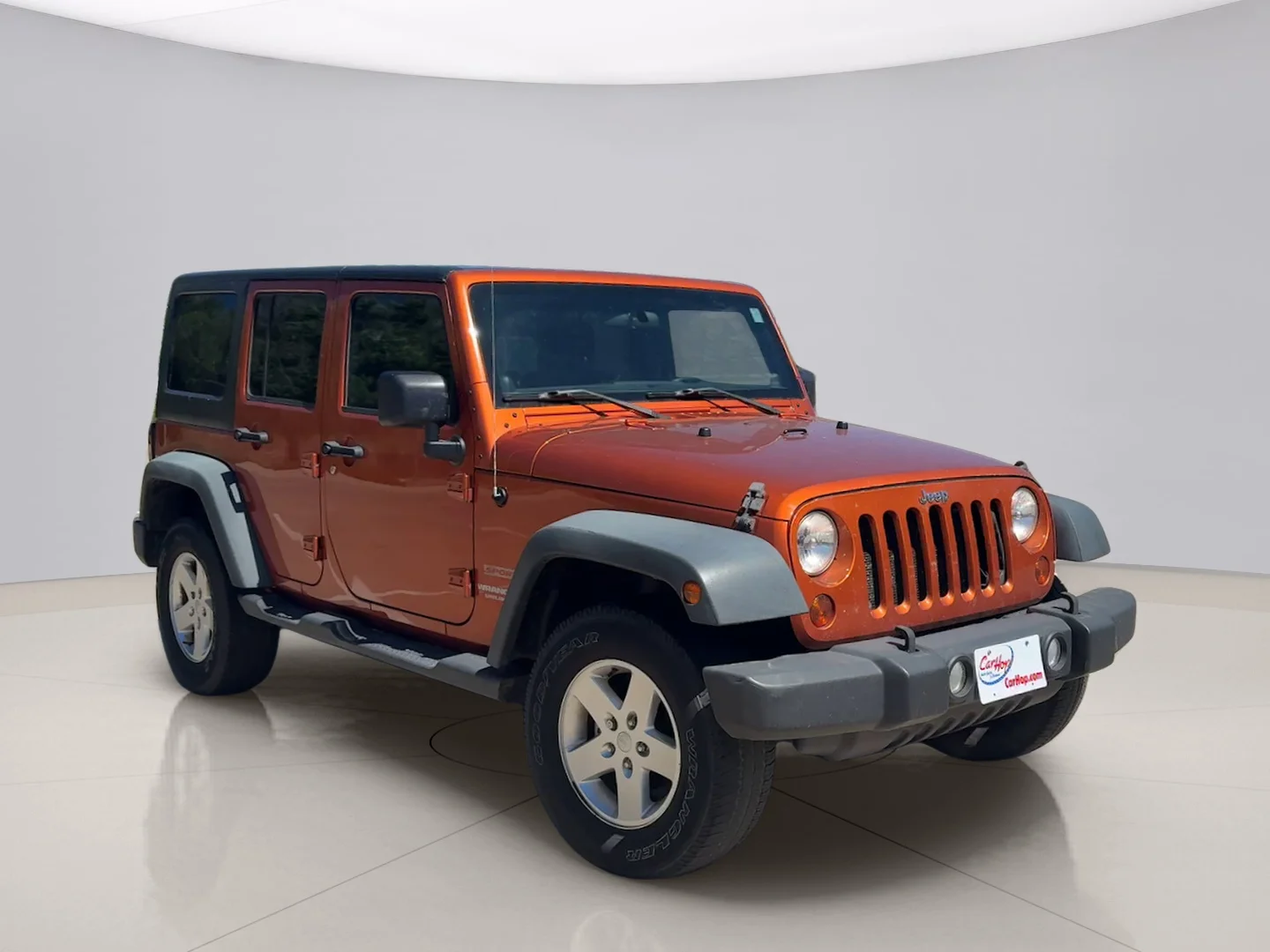 Used 2011 Orange Jeep UNLIMITED image 7
