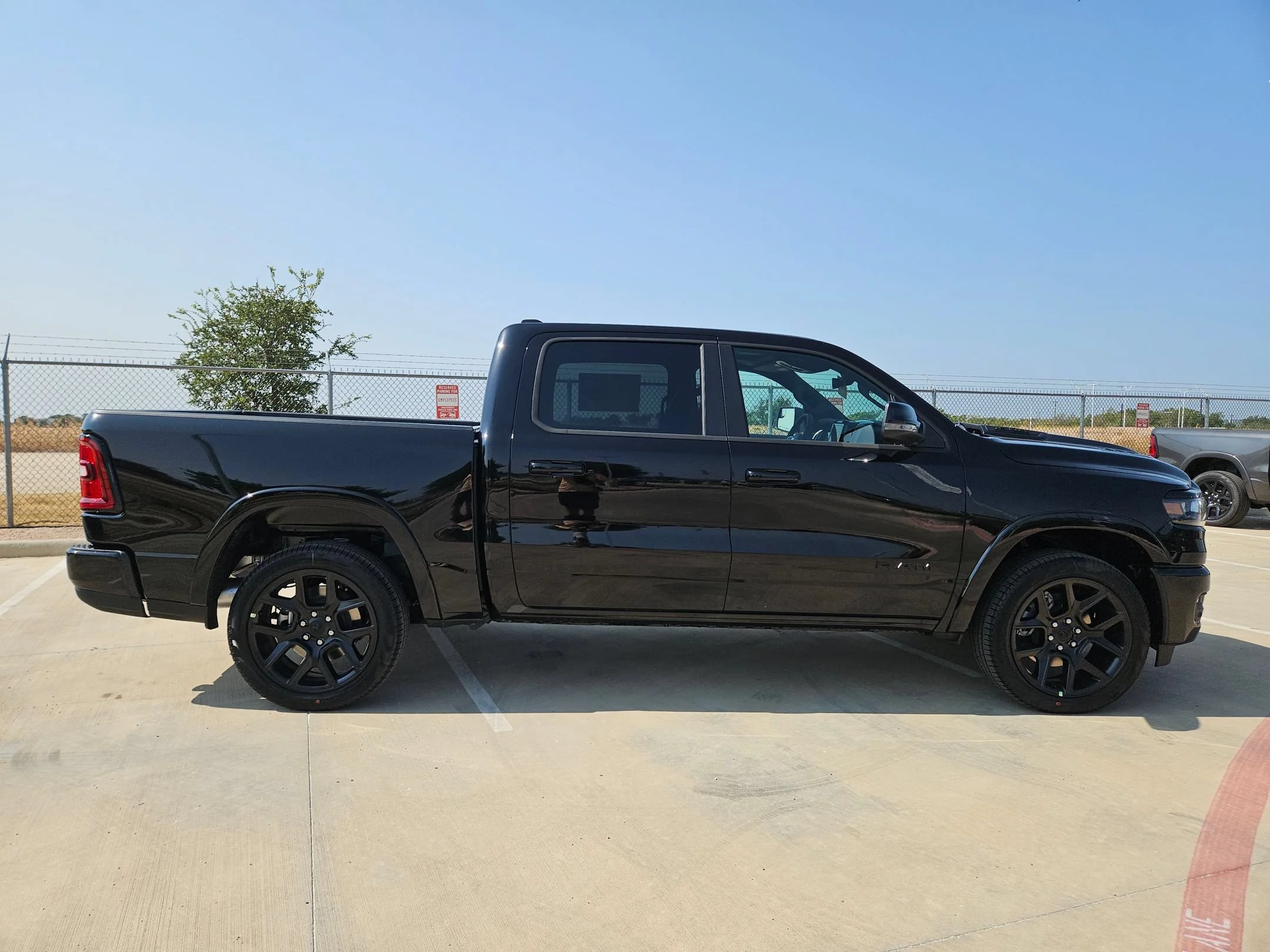 New 2027 Diamond Black Crystal Pearl-Coat Exterior Paint RAM Laramie image 2