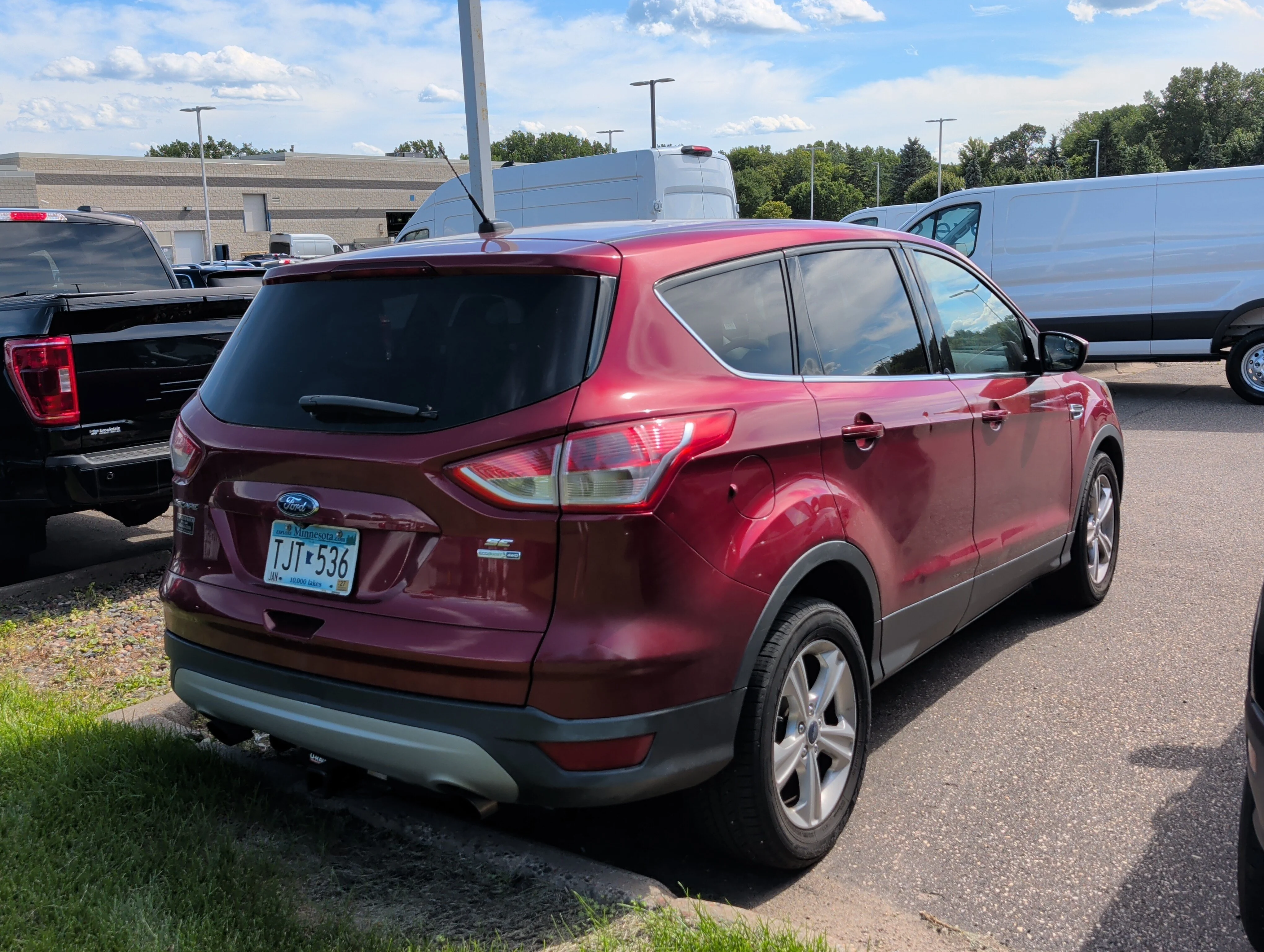 Used 2015 Ruby Red Metallic Tinted Clearcoat Ford SE image 2