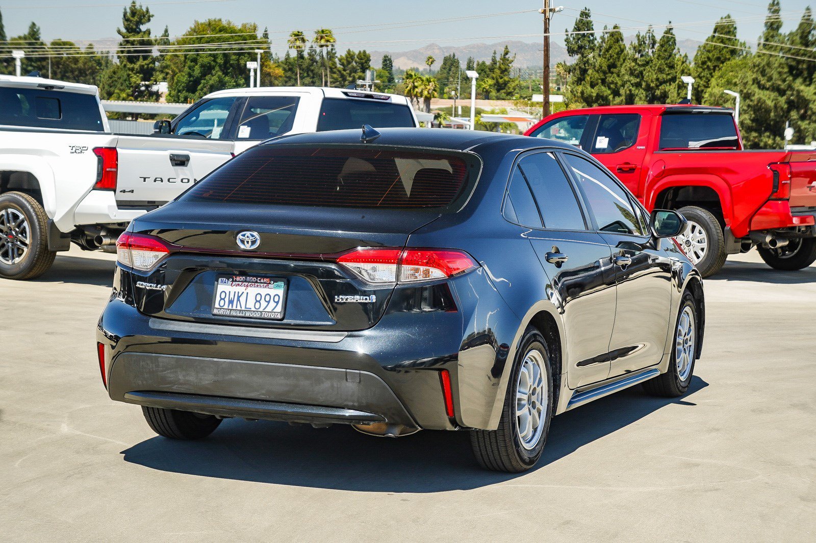 Used 2021 Black Sand Pearl Toyota Hybrid LE image 6