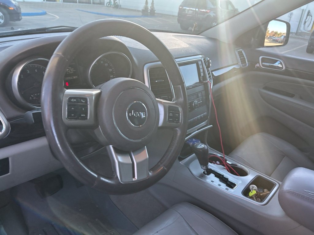 Used 2012 Black Forest Green Pearlcoat Jeep Laredo image 4