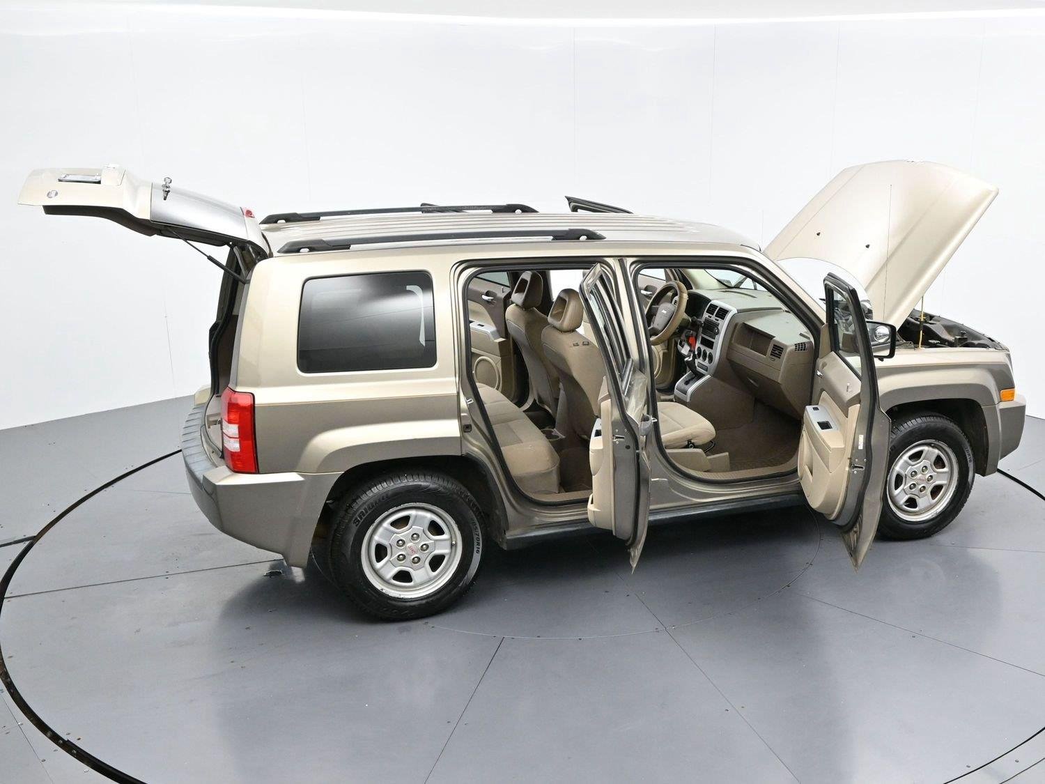 Used 2008 Light Khaki Metallic Jeep Sport image 34