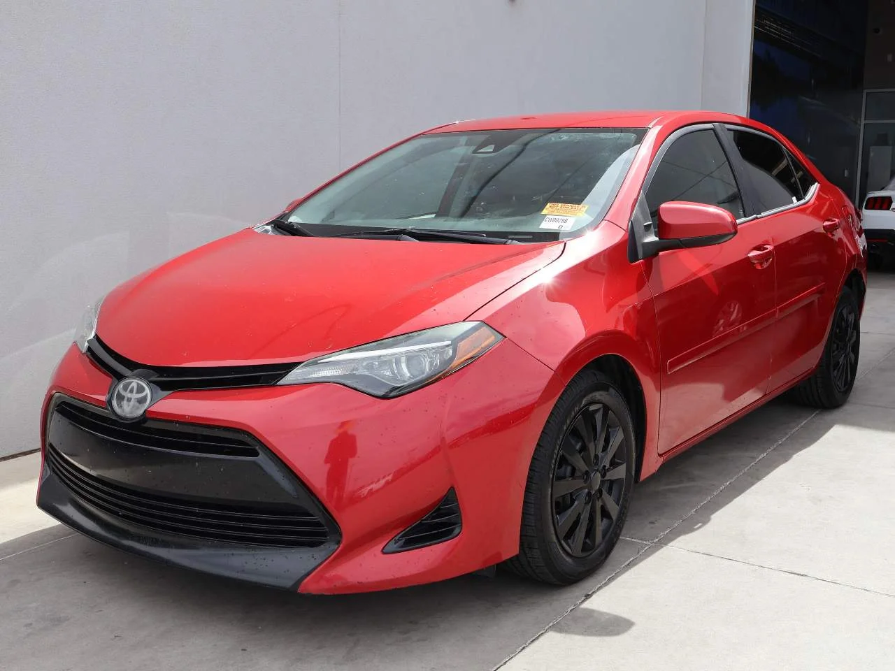Used 2017 Barcelona Red Metallic Toyota LE image 1