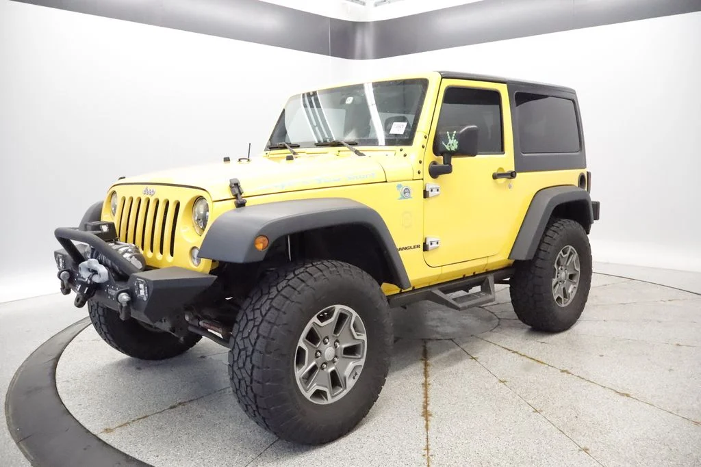 Used 2015 Yellow Jeep Rubicon image 1