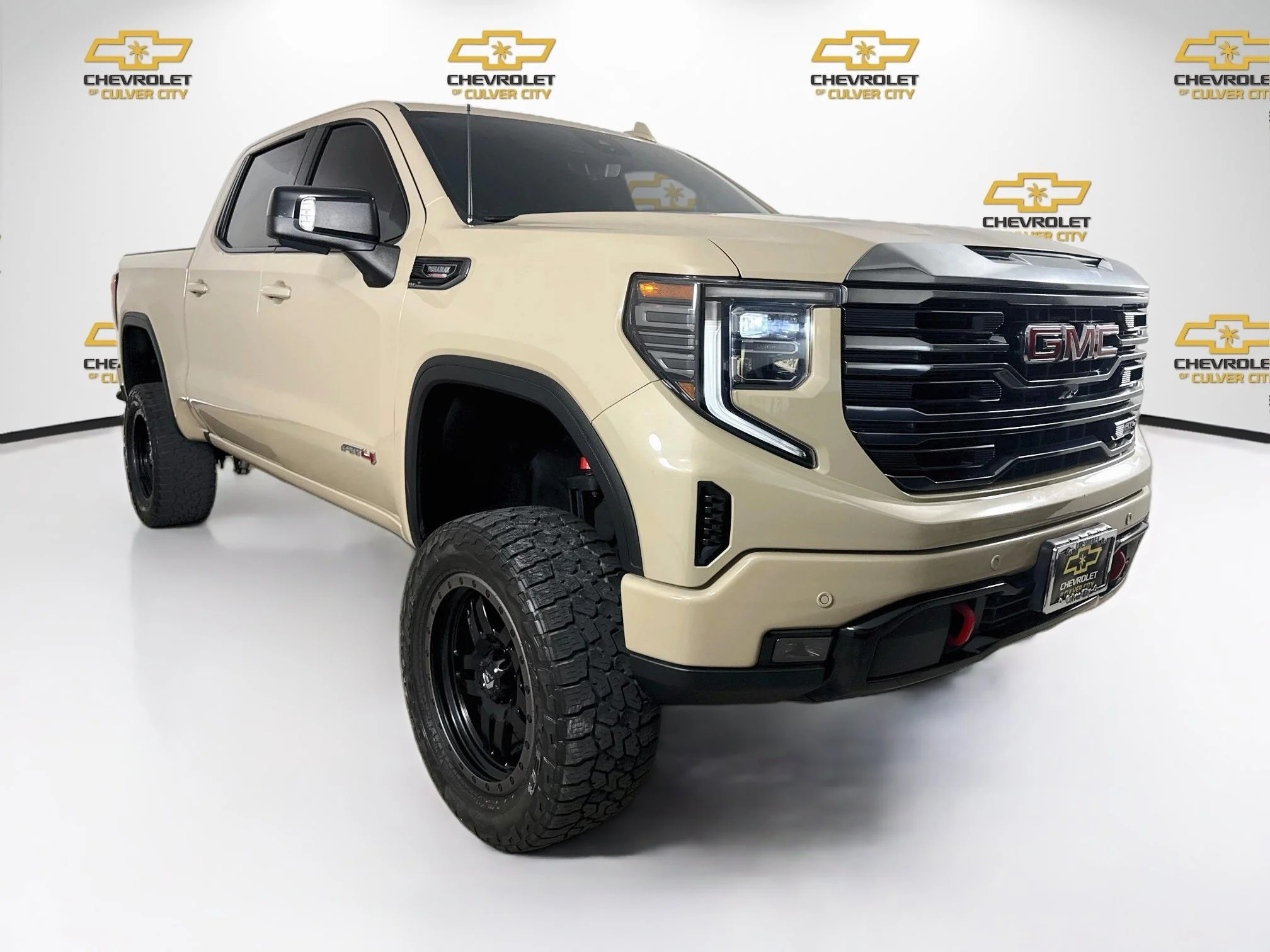 Used 2023 DESERT SAND METALLIC GMC AT4 image 1