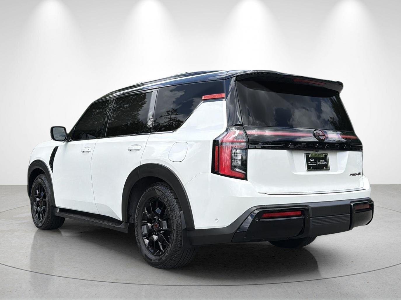 Used 2025 Aspen White Tricoat/Super Black Nissan PRO-4X image 3