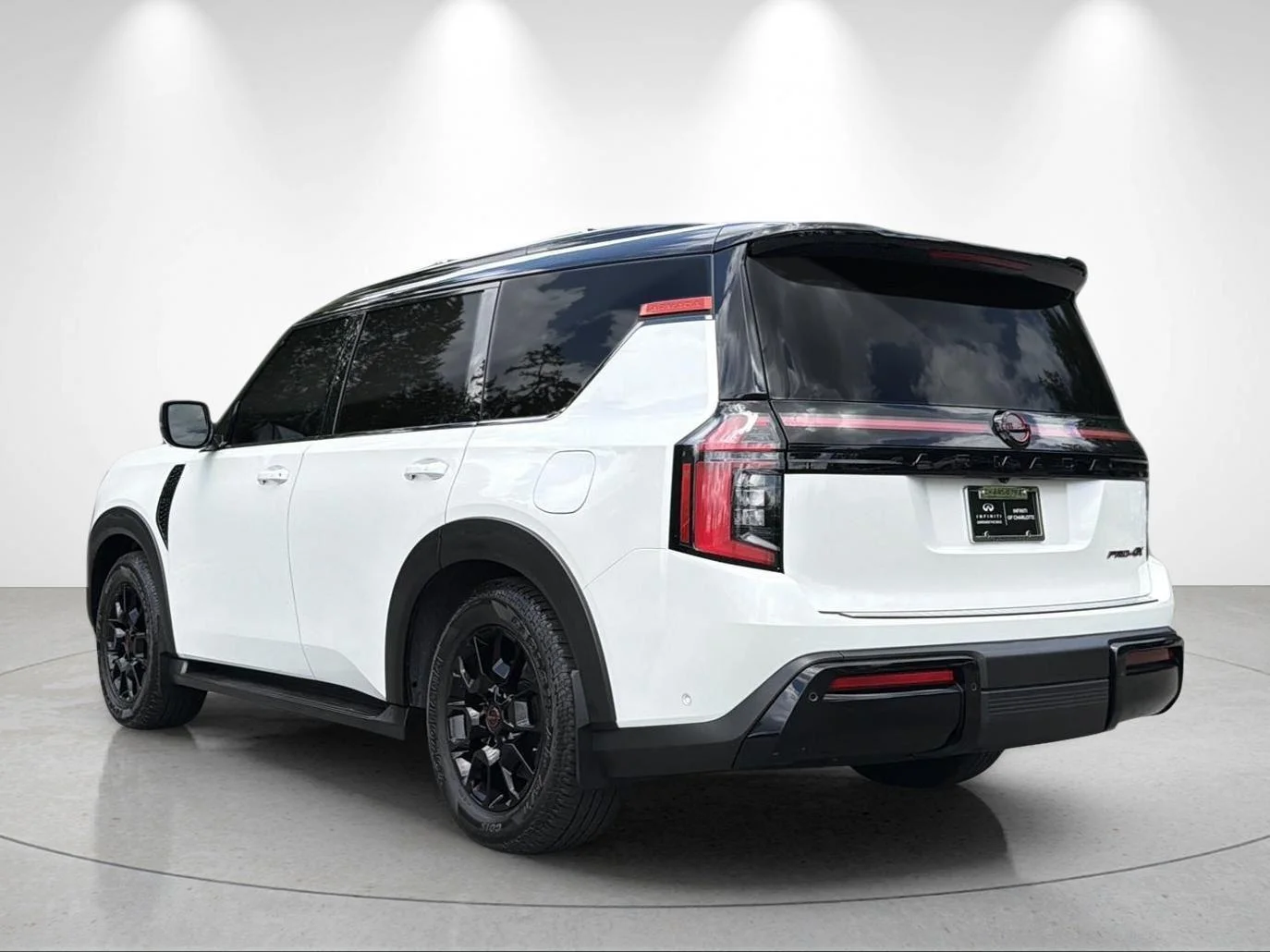 Used 2025 Aspen White Tricoat/Super Black Nissan PRO-4X image 3