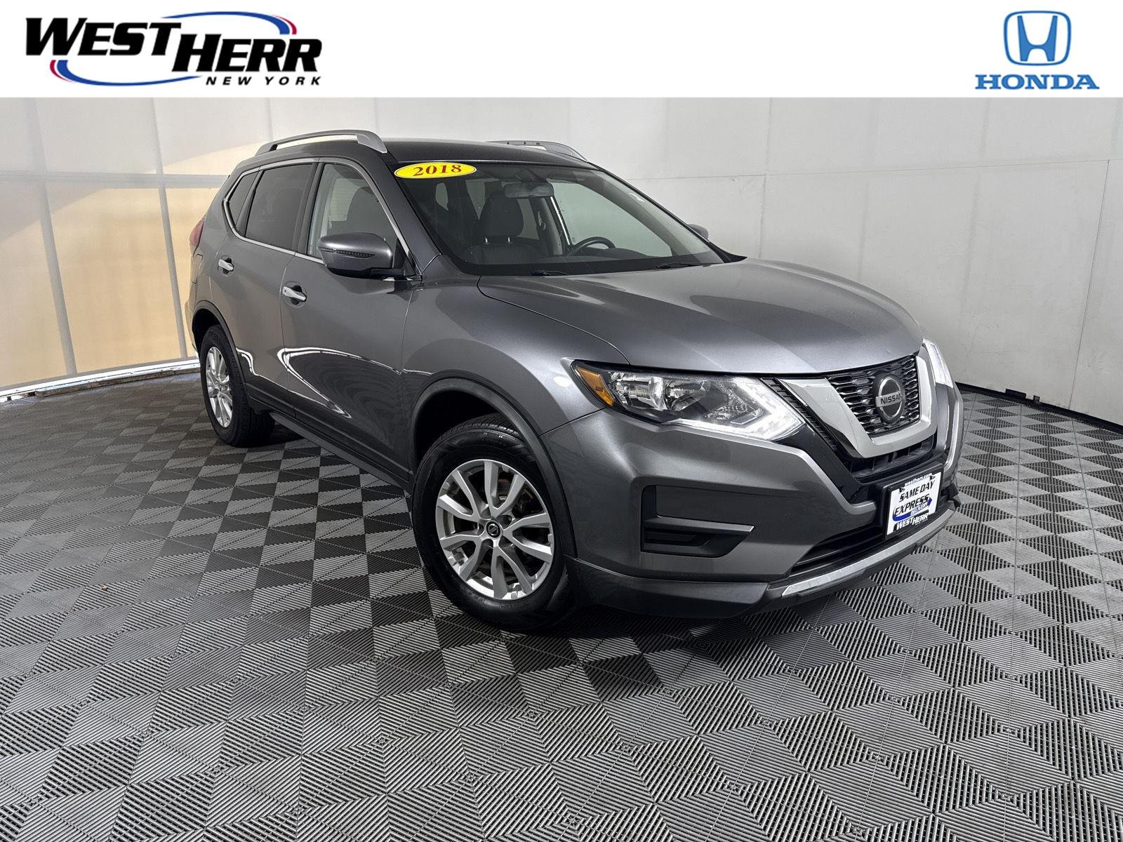 Used 2018 Gun Metallic Nissan SV image 1