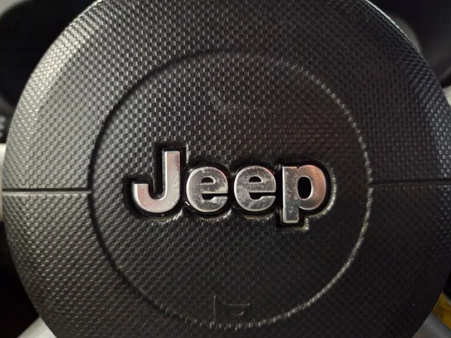 Used 2009 Orange Jeep Unlimited Sahara image 25