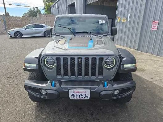 Used 2022 Jeep Wrangler Unlimited Rubicon 4XE with VIN 1C4JJXR64NW110684 for sale in Kansas City