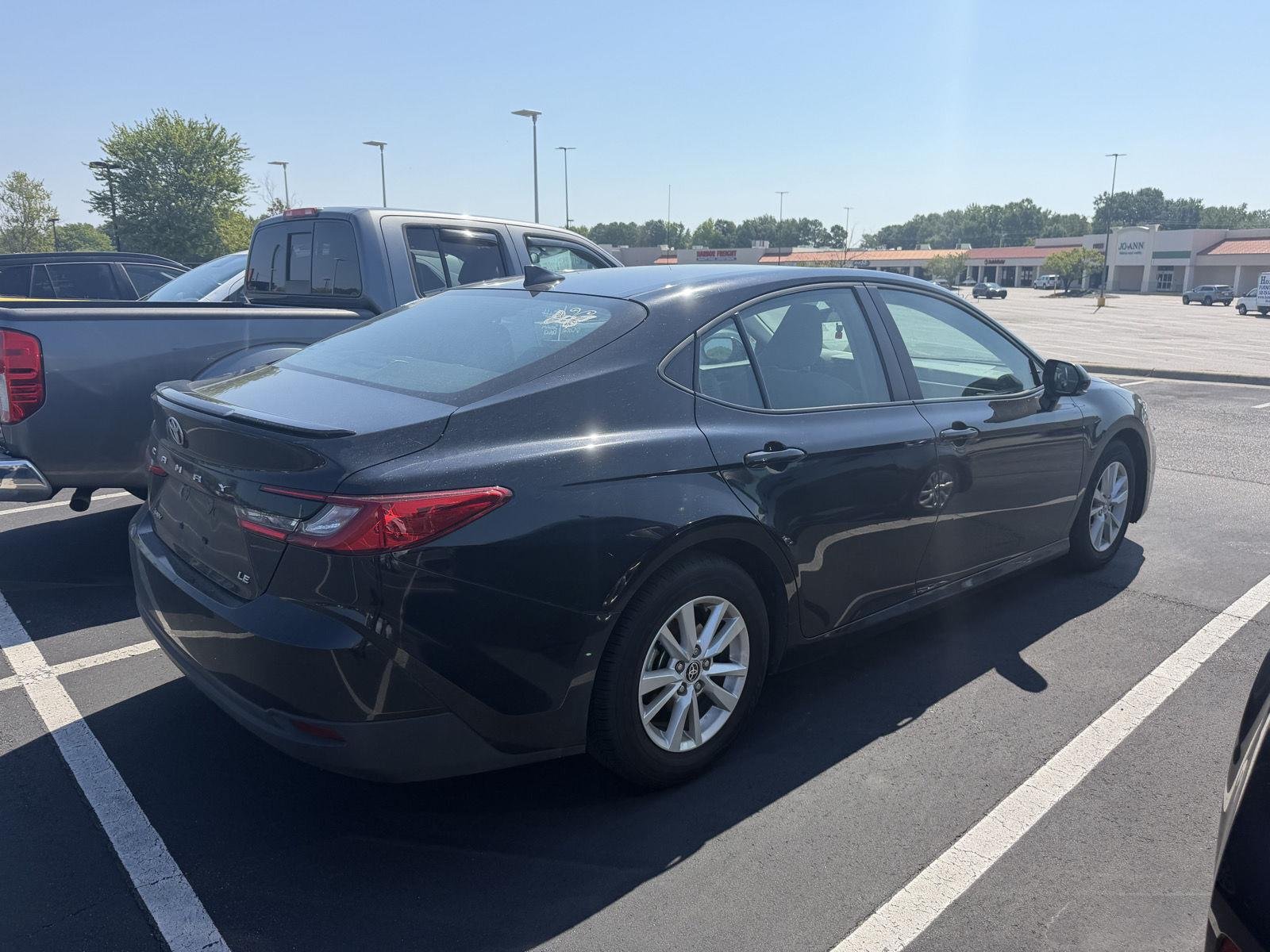 Used 2025 Midnight Black Metallic Toyota LE image 4