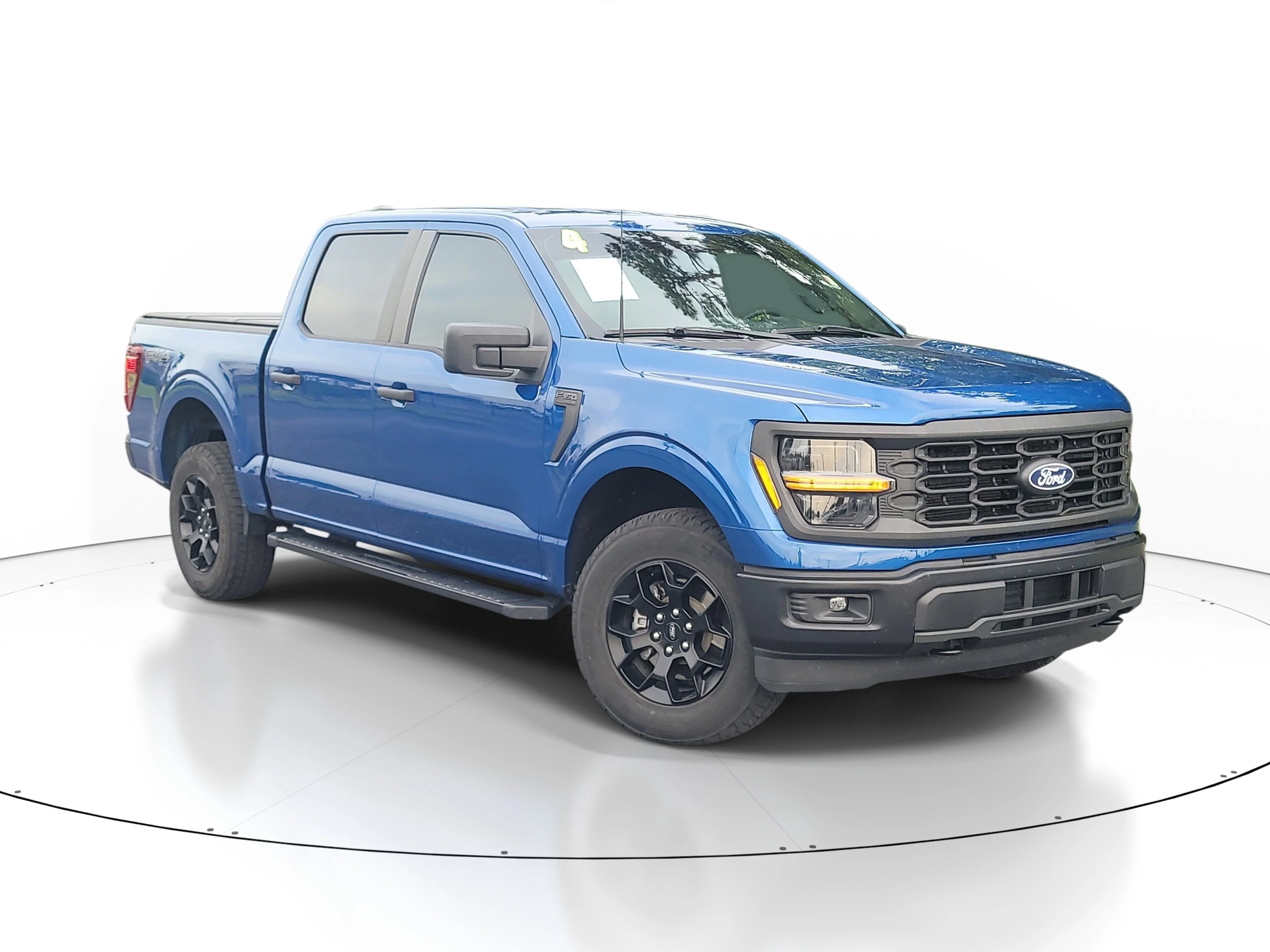 Used 2024 Blue Metallic Ford STX image 1