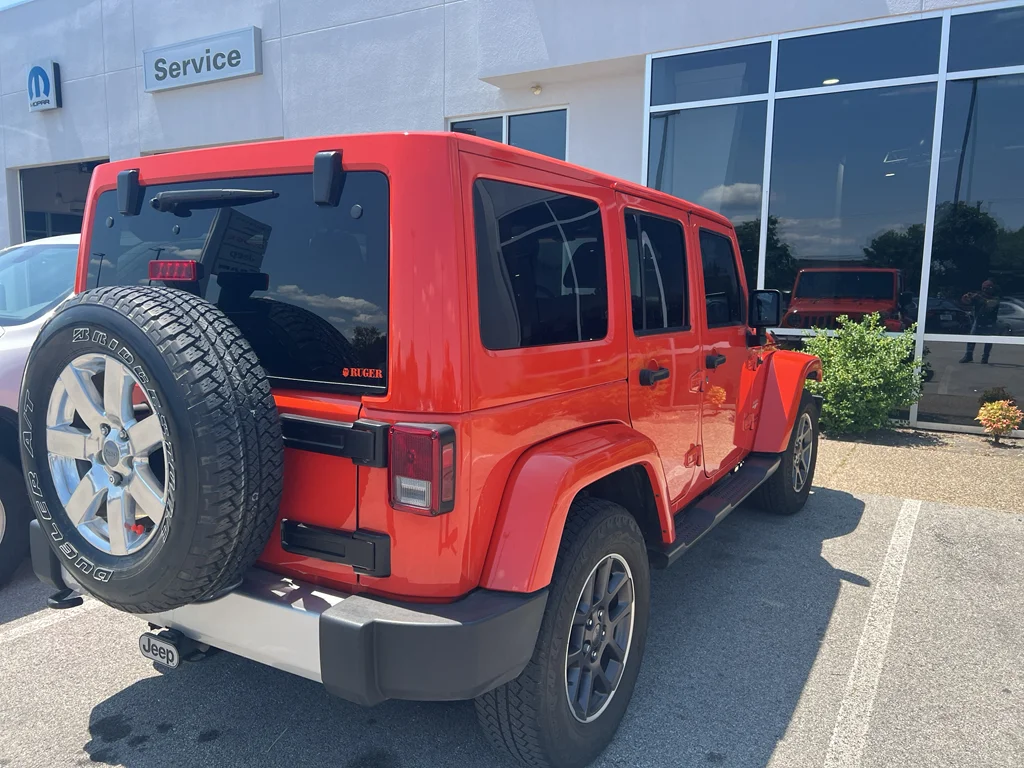 Used 2015 Sunset Orange Pearlcoat Jeep Sahara image 7