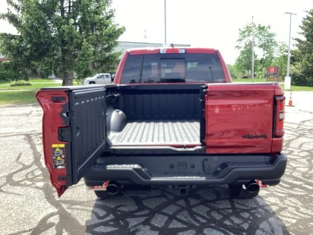 New 2026 Molten Red Ram REBEL CREW CAB 4X4 5