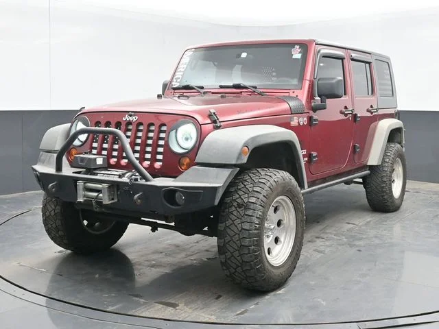 Used 2012 Red Jeep Unlimited Sport image 4