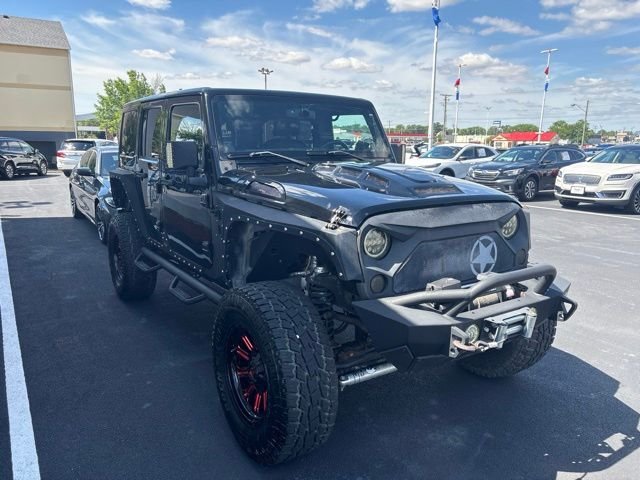 Used 2013 Black Jeep Unlimited Sahara image 9