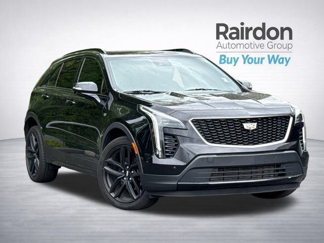 Used 2019 Stellar Black Metallic Cadillac Sport image 1