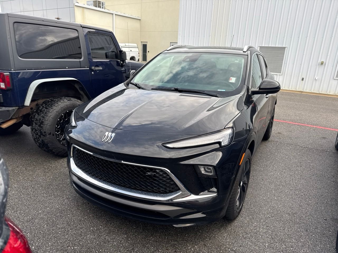 Used 2024 Black Buick Sport Touring image 1