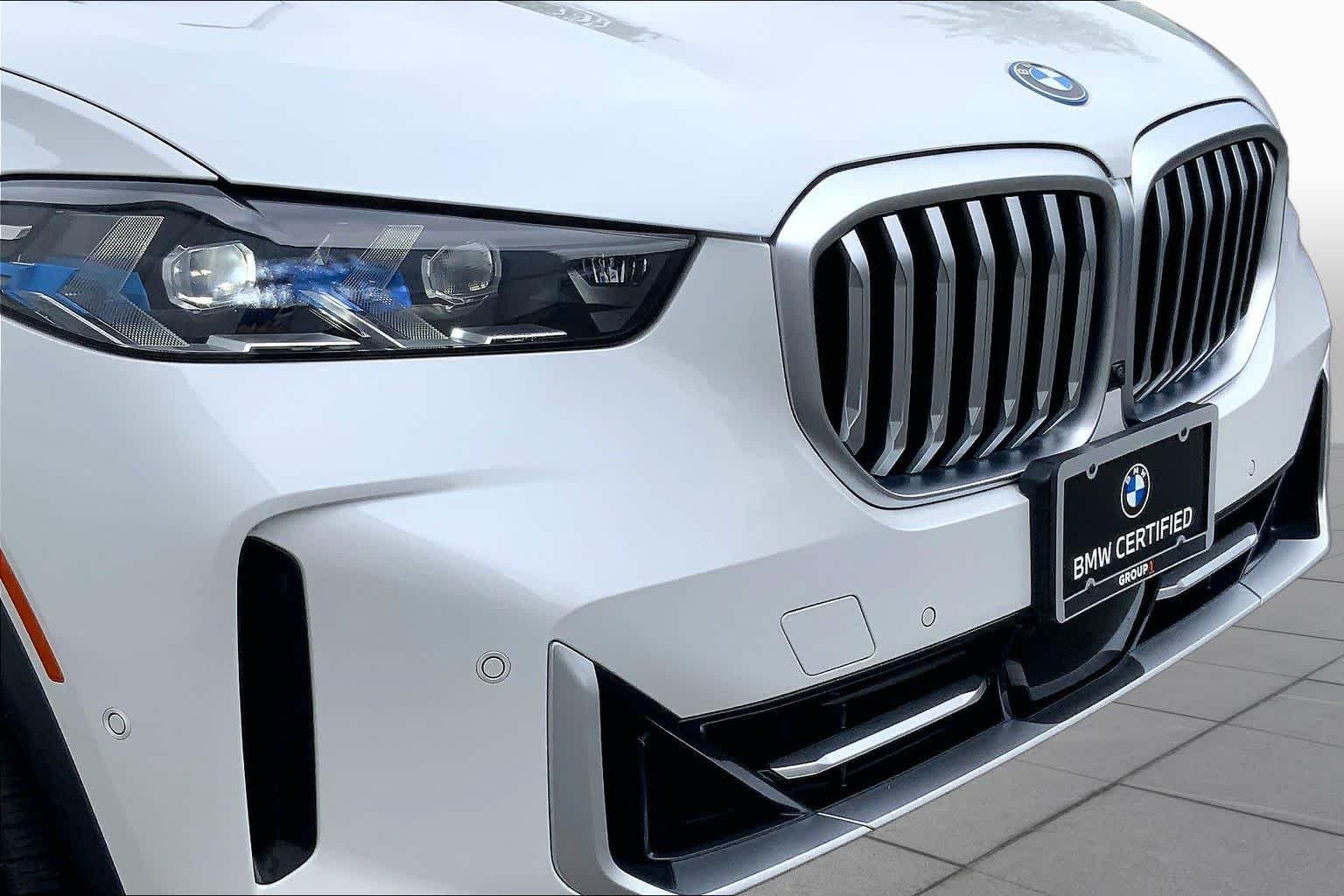 Used 2024 Mineral White Metallic BMW xDrive50e image 31