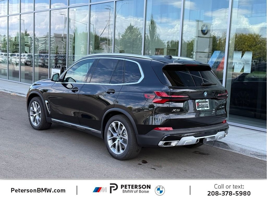 New 2026 Black Sapphire Metallic BMW xDrive50e image 3