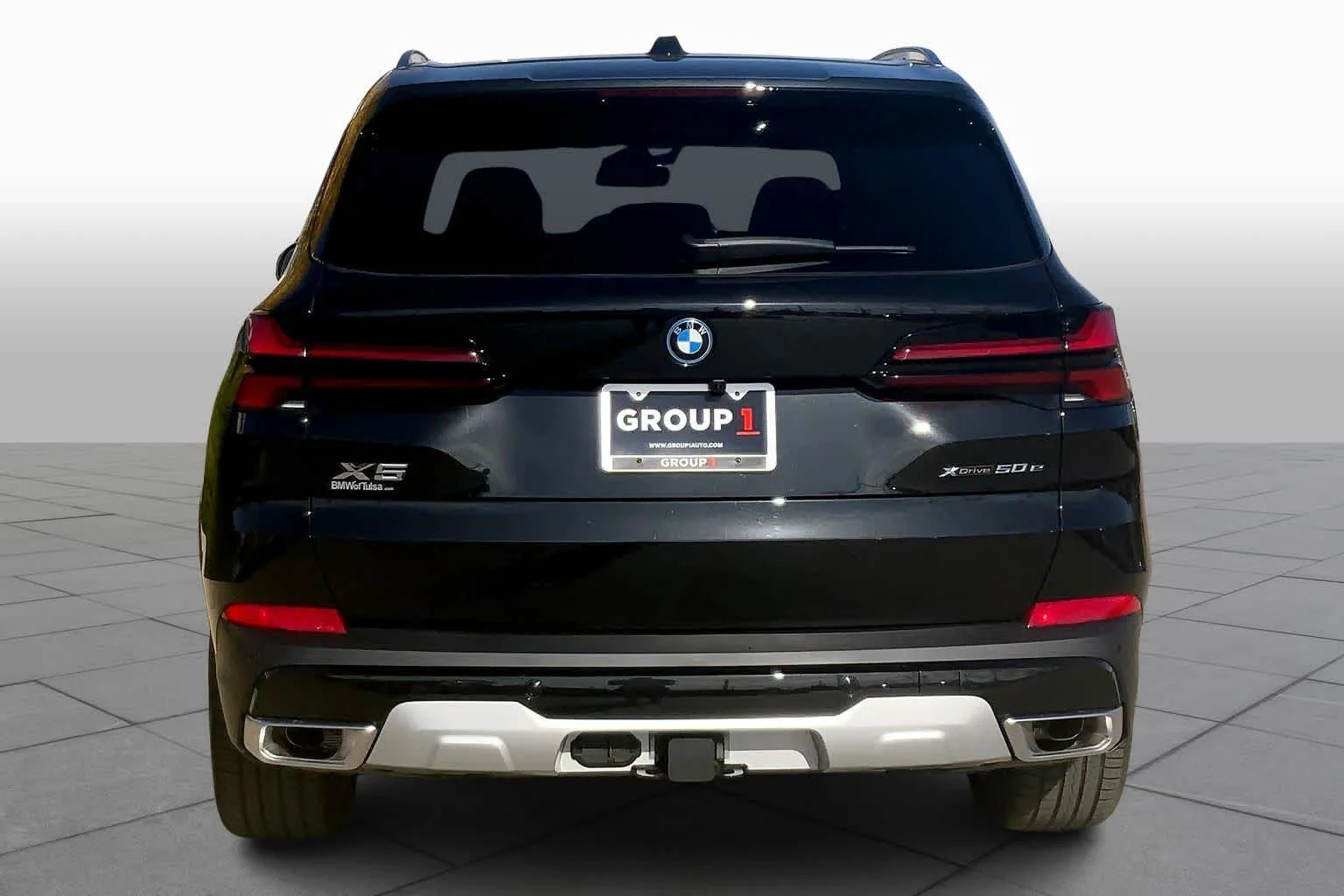 New 2026 Black Sapphire Metallic BMW xDrive50e image 4